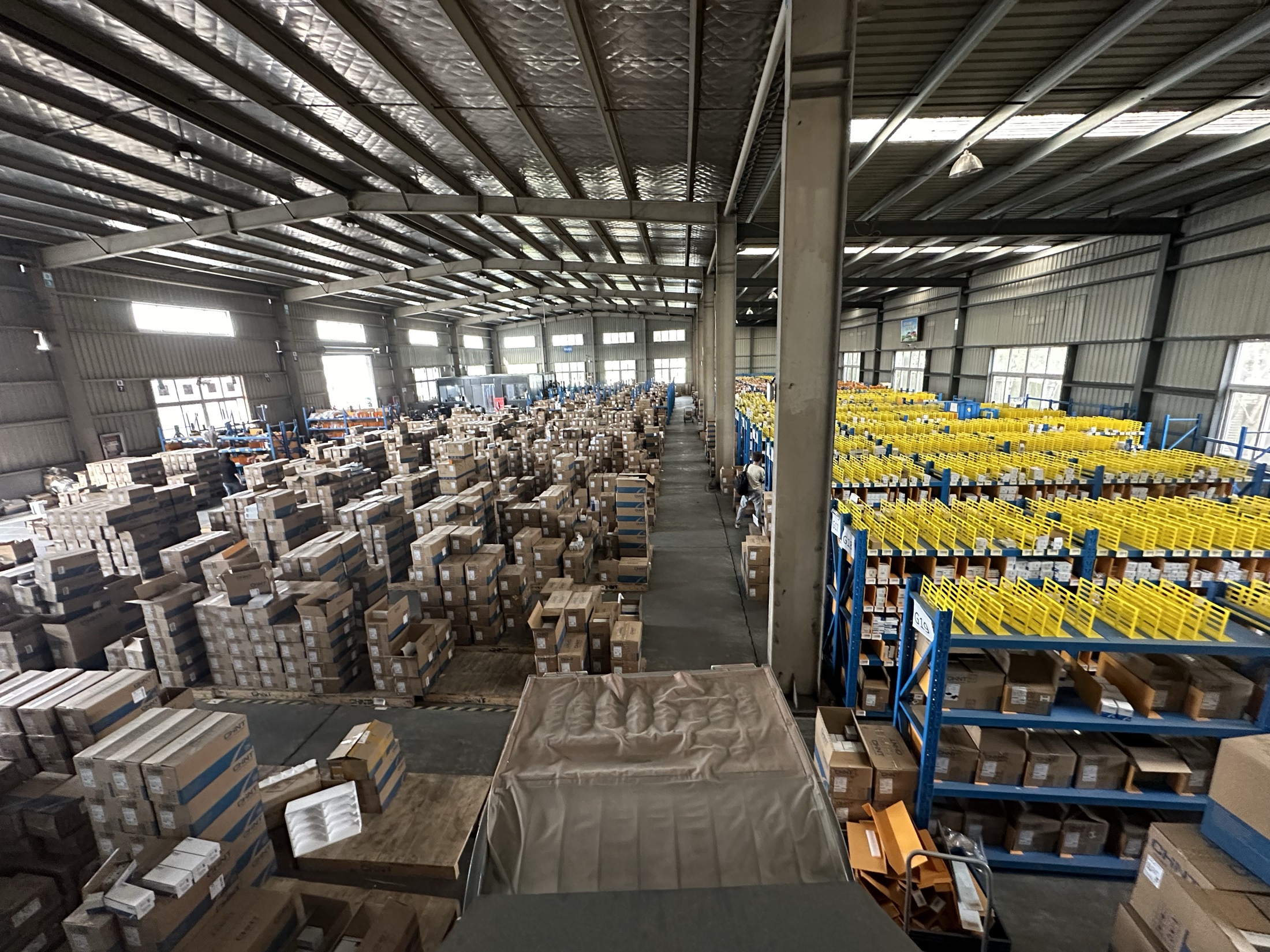 A live industrial distribution warehouse viewed from above